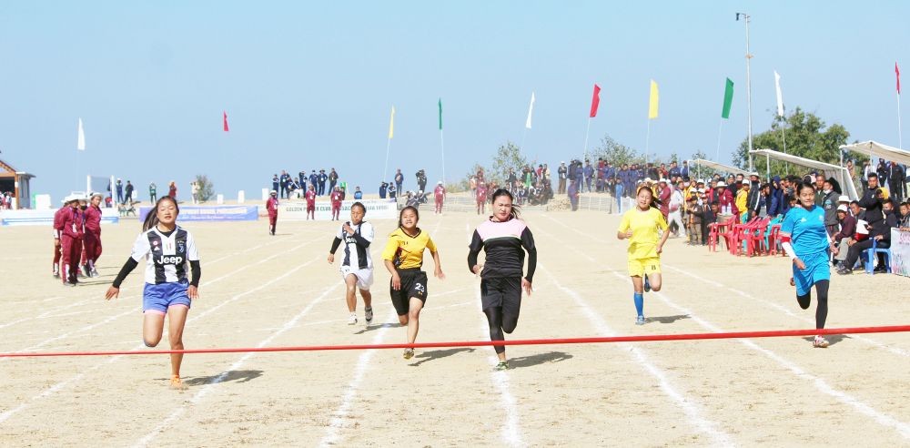 Women athletes approach the finish line during a race at the CAGSA 50th anniversary meet.